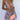 Sparkly festival outfit featuring a sequin skater skirt and backless halter top in lila, size XL.