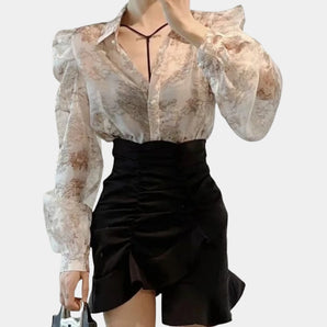 
A vintage-inspired workwear blouse in khaki, featuring sheer floral puffed sleeves and a classic collar, designed for a formal look in a 3XL size.