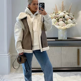 Sherpa fleece vest with buckle worn by a woman styled with jeans, showcasing a casual streetwear look with eyewear, highlighting a white dress shirt underneath the vest, standing confidently displaying the garment's texture and design.