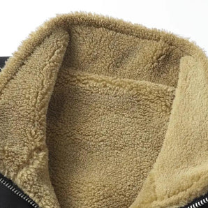 Men's beige sherpa-lined insulated zip jacket with long sleeves, made from woolen material, displayed on a grassy background.