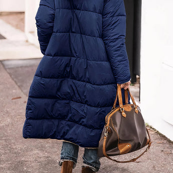 Sherpa-lined parka coat showcasing layered winter fashion with detailed view of shoulder, sleeve, and waist areas.