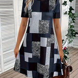 Short geometric summer dress with an asymmetric pattern, featuring a white and black design, sleeveless shoulder style, and a round neck.