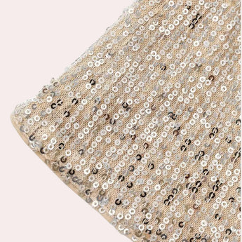 Silver sequin V-neck sleeveless tank top with a sparkling embellishment pattern, designed for evening wear.