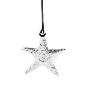 Handmade silver star pendant necklace with a celestial galaxy design, featuring intricate patterns and a circular ornament, showcasing a unique combination of artistic elements and fashion accessory appeal.