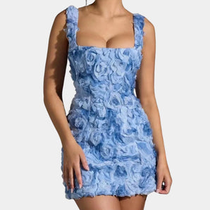Sky blue sleeveless mini dress with 3D floral design, featuring a fitted waist and a round neckline, perfect for summer parties.