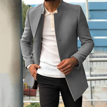 Gray slim fit camel coat styled as a modern men's blazer for autumn fashion, featuring a dress shirt underneath with a visible collar and sleeves.