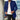 Men's slim fit camel coat in blue, modeled by a man wearing a dress shirt and jeans, highlighting the coat's modern design with a focus on the collar and sleeves, suitable for autumn fashion.