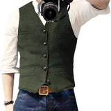 Men's slim-fit denim vest in stylish blue with button-up design, worn over a dress shirt.