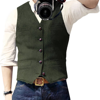 Men's slim-fit denim vest in stylish blue with button-up design, worn over a dress shirt.