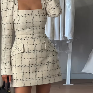 Square neck plaid puff sleeve peplum mini dress with tailored fit, featuring a white day dress design with prominent shoulders and a defined waist.