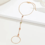 Elegant women's dainty hand bracelet with an adjustable star charm, made of metal, designed as a fashion accessory.