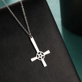 Steampunk Silver Gear Cross Pendant Necklace featuring intricate industrial design with gears and a silver cross on a chain.