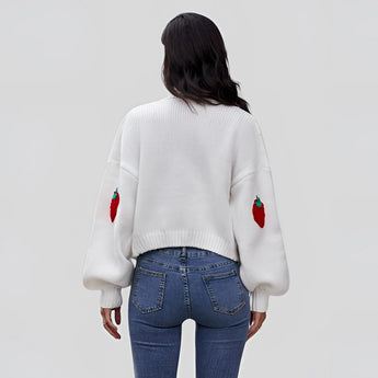 Women's trendy V-neck strawberry knit cardigan with long sleeves, modeled paired with jeans, showcasing a casual and stylish outerwear look.