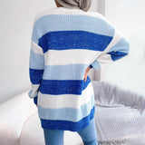 Striped black and white long sleeve women's cardigan, featuring a cozy knit design, perfect for fall fashion.