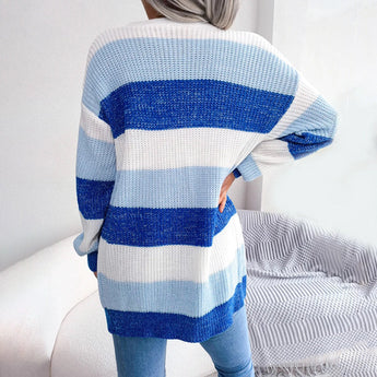 Striped black and white long sleeve women's cardigan, featuring a cozy knit design, perfect for fall fashion.