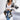 Striped black and white long sleeve women's cardigan worn by a model. The cardigan features a stylish design with bold stripes, extending to the waist and thighs, perfect for fall fashion.