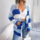 Striped black and white long sleeve women's cardigan displayed on a mannequin, highlighting the fall fashion knitwear style with emphasis on the sleeve and waist design.