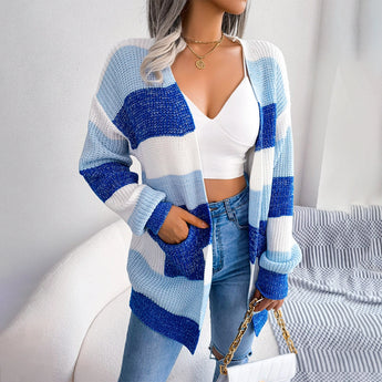 Striped black and white long sleeve women's cardigan displayed on a mannequin, highlighting the fall fashion knitwear style with emphasis on the sleeve and waist design.