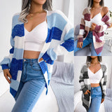 Striped black and white long sleeve women's cardigan styled with jeans, showcasing fall fashion knitwear.