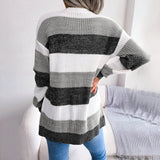 Striped black and white long sleeve women's cardigan, featuring a knit design with a fall fashion style. The cardigan has a collar and fits comfortably around the shoulders, neck, sleeves, and waist.