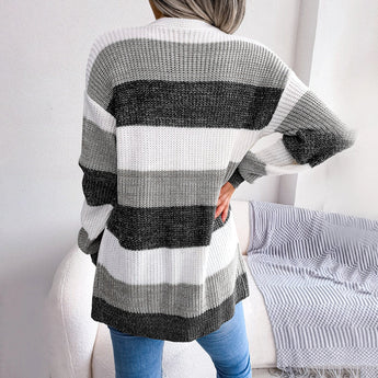 Striped black and white long sleeve women's cardigan, featuring a knit design with a fall fashion style. The cardigan has a collar and fits comfortably around the shoulders, neck, sleeves, and waist.