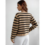 Striped blue and white knit cardigan featuring a casual chic design with button-up front, long sleeves, and a comfortable fit, perfect for layering.