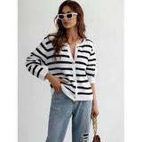 Striped blue and white knit cardigan styled as a casual chic button-up sweater, worn by a person with black hair, featuring a focus on the shoulder and neck area.