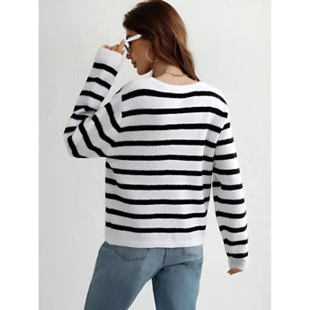Striped blue and white knit cardigan with button-up front, featuring long sleeves and a casual chic style.