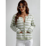 Striped blue and white knit cardigan sweater worn by a smiling person with sunglasses, showcasing the casual chic button-up design, long sleeves, and comfortable fit around the waist and shoulders.