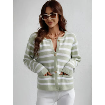 Striped blue and white knit cardigan sweater worn by a smiling person with sunglasses, showcasing the casual chic button-up design, long sleeves, and comfortable fit around the waist and shoulders.