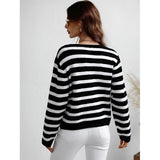 Striped blue and white knit cardigan with button-up front, featuring long sleeves and a casual chic style. The sweater has a collar and appears lightweight, suitable for a relaxed yet stylish look.