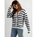 Striped blue and white knit cardigan with button-up front, featuring long sleeves and a casual chic design, worn over a grey jersey T-shirt.