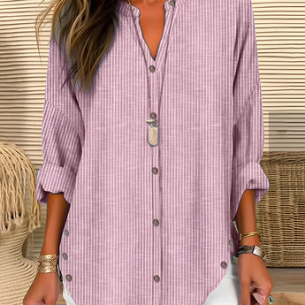 A striped blue and white women's V-neck blouse, featuring long sleeves, suitable for beachwear.