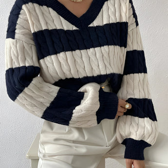 A marine blue XL striped cable knit women's sweater with puff sleeves and a crewneck design.