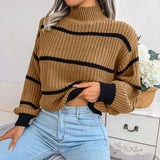 Tan and black striped chunky turtleneck sweater featuring long sleeves and a cozy collar, perfect for casual winter wear.