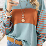 Striped color block long sleeve casual pullover sweater for women in style 5 and size 2XL, featuring white, blue, and orange color blocks. The sweater has a round neck and is shown on a model.