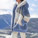 Striped fleece women's hooded sherpa jacket in warm colorblock plush featuring a mix of white, azure, blue, and grey hues with tartan pattern accents, shown on a standing model.