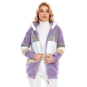 Woman wearing a purple, 3XL, striped fleece hooded sherpa jacket with colorblock plush design, showing the outerwear's soft and warm texture.