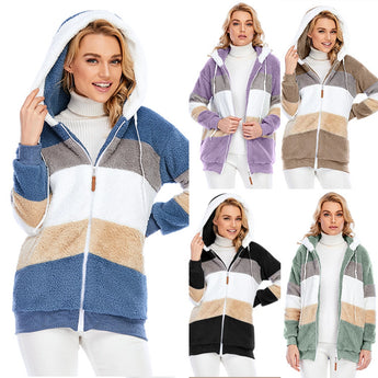 Striped fleece women's hooded sherpa jacket in warm colorblock design, showcasing a plush texture with a cozy hood, visible sleeves, and a comfortable fit around the neck and waist. The woman wearing the jacket is smiling, emphasizing the jacket's fashionable and cozy design.