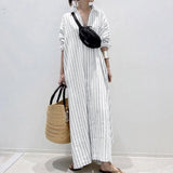 Striped maxi shirt dress with long sleeves in a lightweight fabric, featuring a classic collar and a relaxed fit, ideal for beachwear. The dress is shown in a white color and size 3XL.