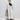 Striped maxi shirt dress with long sleeves in a lightweight fabric, featuring a classic collar and a relaxed fit, ideal for beachwear. The dress is shown in a white color and size 3XL.