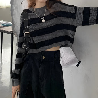 Striped oversized black and white knit sweater with long sleeves, featuring a trendy autumn fashion design. The sweater is shown in a black and white color scheme, emphasizing its distinctive striped pattern and cozy fit, suitable for an XL size.