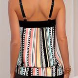 Women's striped tankini top with adjustable straps, featuring black and white stripes, modeled against a plain background. The beachwear showcases a sleeveless design, highlighting the shoulders and neck area.