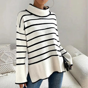 Black and white striped turtleneck sweater for women, featuring long sleeves and a snug fit, suitable for fall fashion.