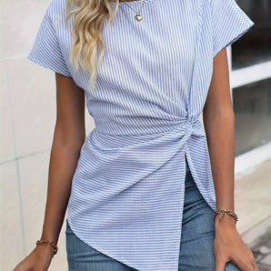 Blue and white striped twist-front blouse, casual chic top with long sleeves and a v-neckline, paired with jeans.