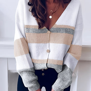 Striped V-neck button-front two-tone women's cardigan sweater in white, featuring long sleeves and a tailored fit in XL size, displayed on a mannequin.