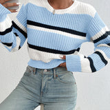Striped women's black and white crew neck sweater featuring a chic, winter knitwear design.