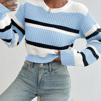 Striped women's black and white crew neck sweater featuring a chic, winter knitwear design.