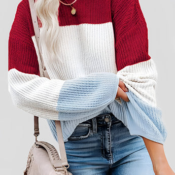 Striped women's color block sweater in red, size 3XL, displayed on a model wearing blue jeans. The top features a stylish knitwear design, perfect for fall fashion.