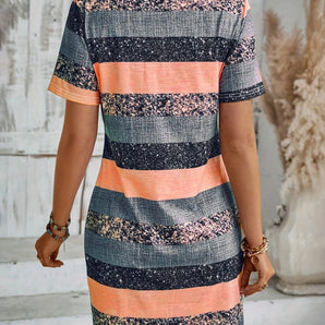A peach and gray striped women's summer dress made from a casual cotton blend, featuring short sleeves and a fitted waist.